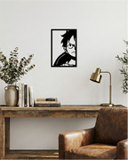 Decoración de oficina con estilo industrial, cuadro calado en madera negra de diseño sobrio inspirado en piratas.