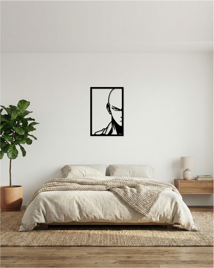 Cuadro decorativo calado instalado en dormitorio juvenil, diseño de héroe calvo en MDF negro con toque artístico.